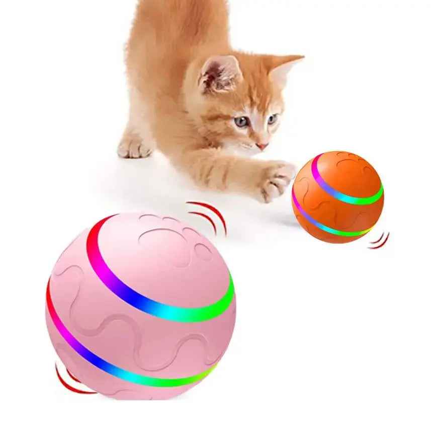 Pink and orange interactive cat ball toys by NexiPets, with colorful LED stripes and a kitten batting at one.