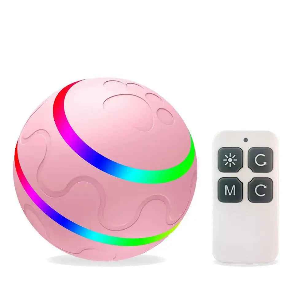 Pink interactive cat ball toy by NexiPets with a rainbow light stripe, paw print texture, and a white remote control.